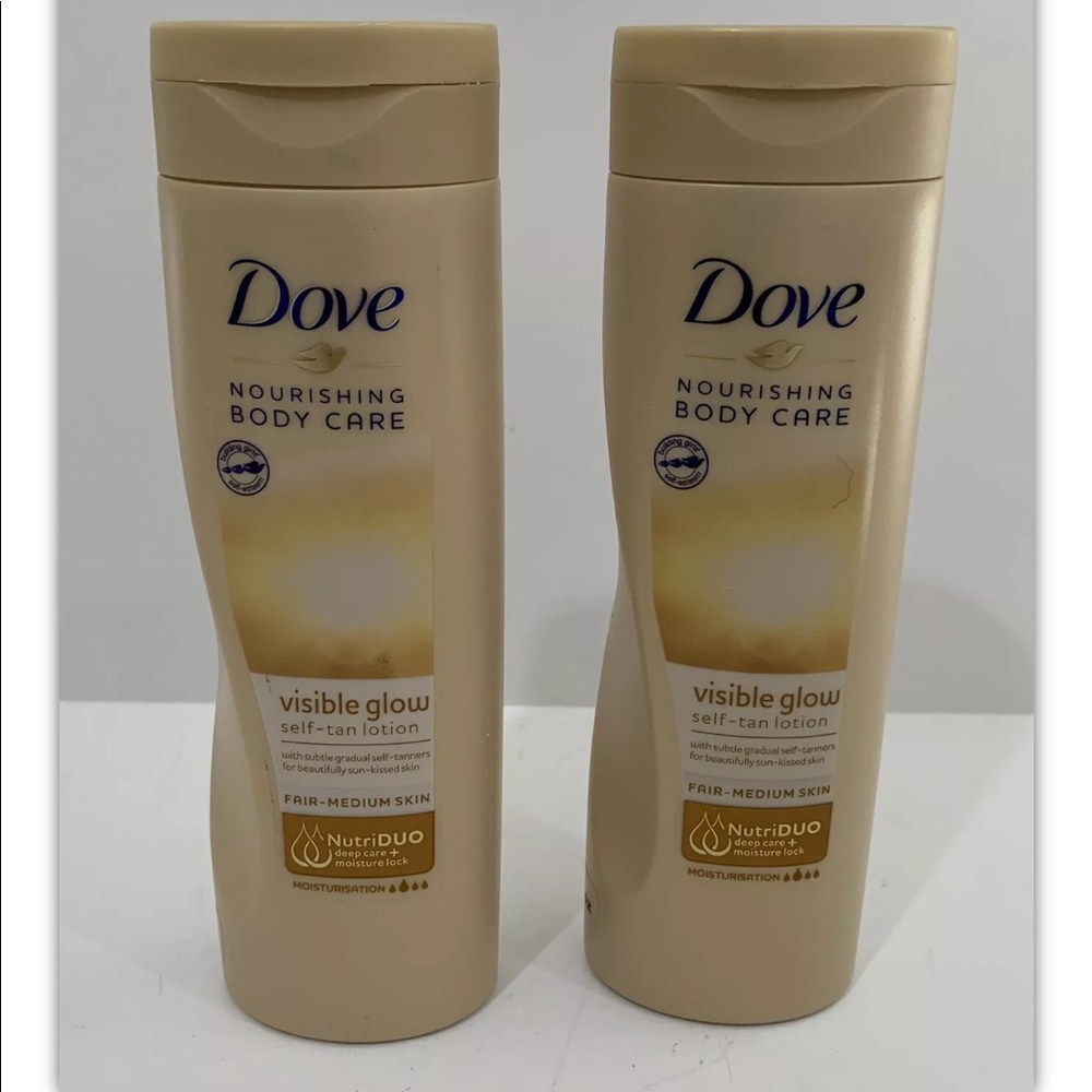2 Dove Nourishing Body Care Self-Tan Lotion.
